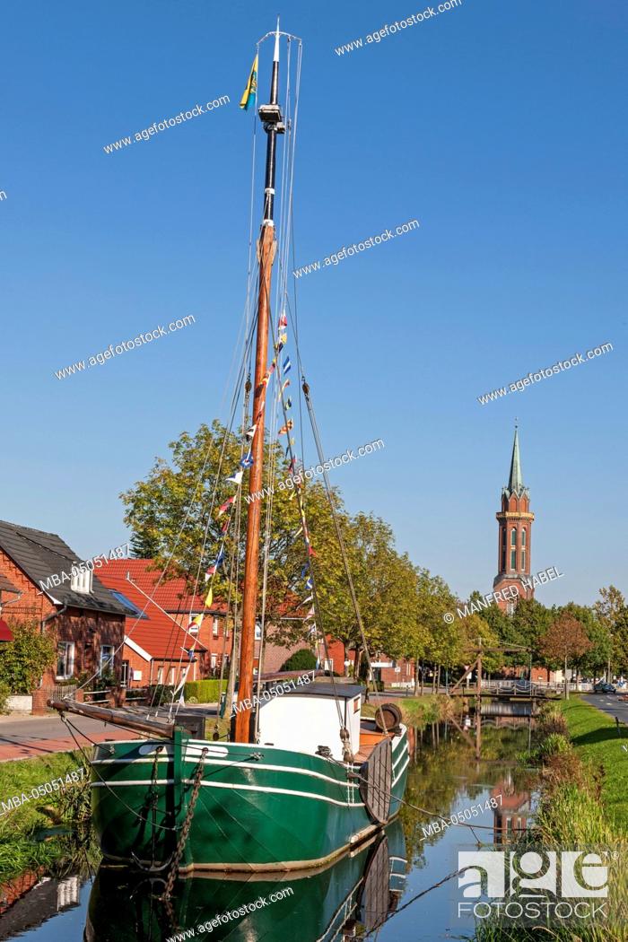 Stock Photo: Westrhauderfehnkanal (canal), boat 'Tjalk Engelina' in front of Fehn and maritime museum in Westrhauderfehn, Evangelical-Lutheran church of hope, Rhauderfehn.