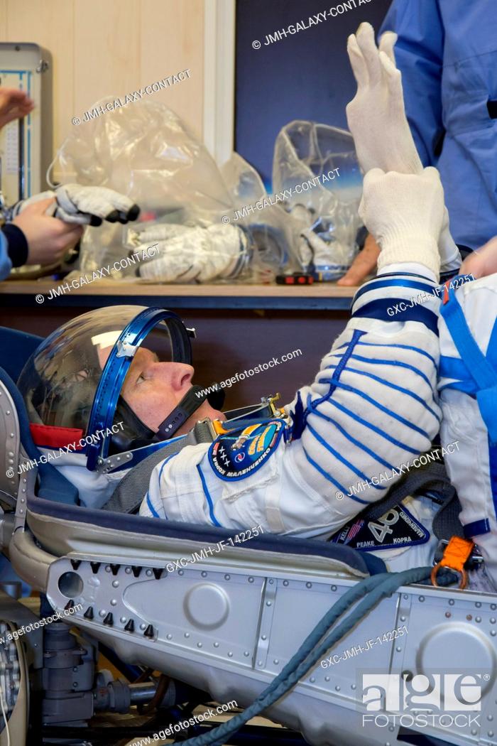 Stock Photo: In the Integration Facility at the Baikonur Cosmodrome in Kazakhstan, Expedition 46-47 crewmember Tim Peake of the European Space Agency conducts a pressure and.