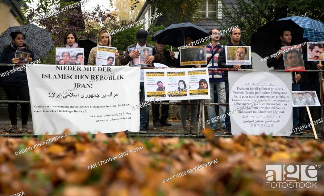 Stock Photo: A small group of demonstrators protest against the execution of political prisoners in Iran in front of the nation's embassy in Berlin, Germany, 10 October 2017.