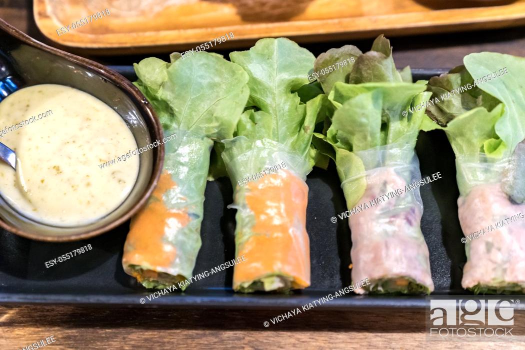 Photo de stock: Salad rolls with dipping sauce.