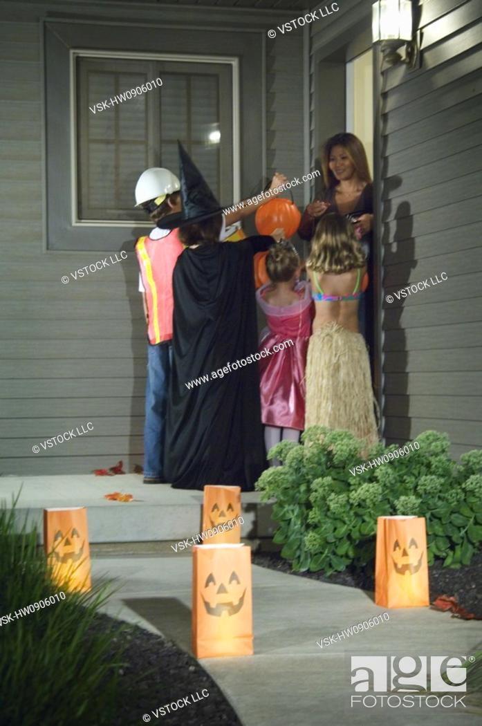 Stock Photo: Kids trick or treating.
