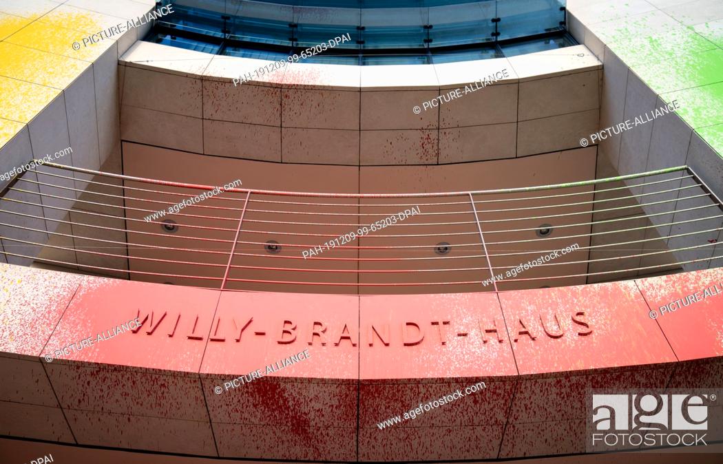 Stock Photo: 09 December 2019, Berlin: Colourful paint can be seen in the morning at the entrance of the Willy Brandt House, the SPD headquarters.