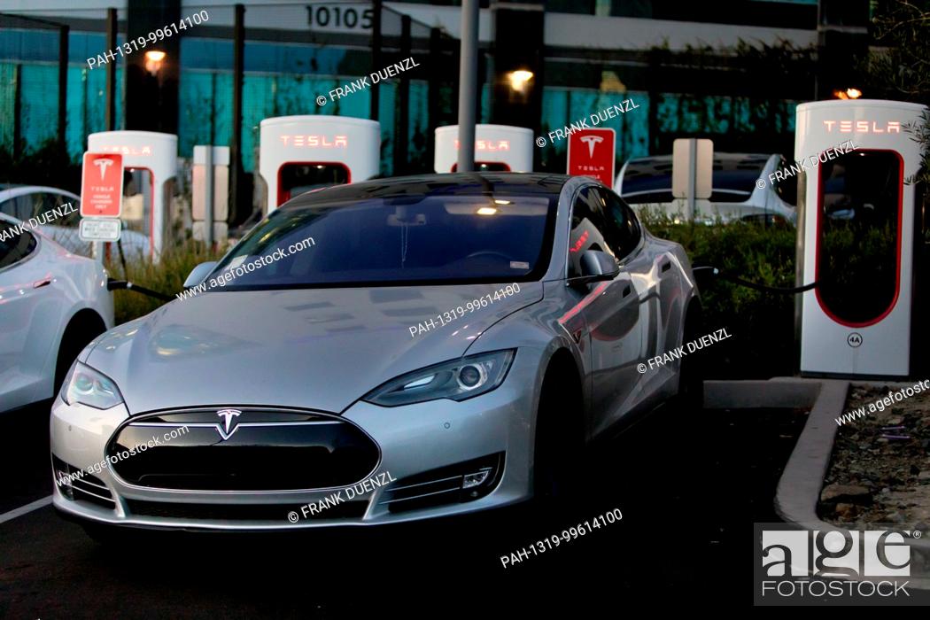 Stock Photo: Teslas charging at the Supercharger at the Qualcomm parking lot in Sorrento Valley, where many high tech, biotech, and IT companies are located, in Febuary 2018.