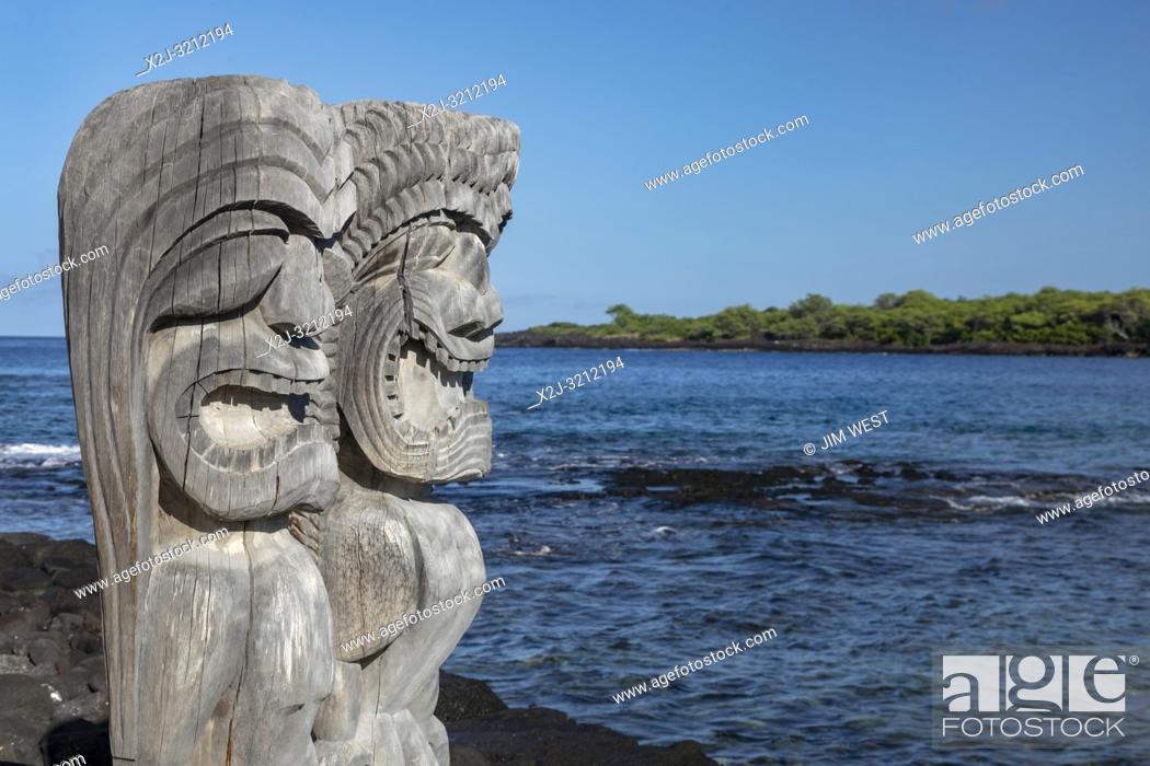 Stock Photo: Honaunau, Hawaii - Two ki'i (wood carvings of Hawaiian gods) at Pu'uhonua o Honaunau National Historical Park. In ancient Hawaii, this was the place of refuge.