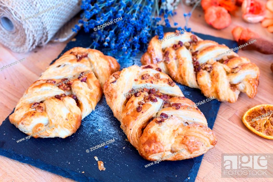 Stock Photo: marple and pecan plait pastry sweet food breakfast with lavender flowers.