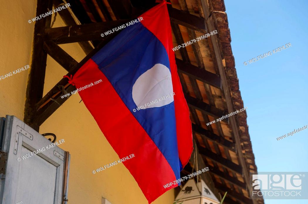 Stock Photo: The national flag at a house in the UNESCO world heritage town of Luang Prabang in Central Laos.