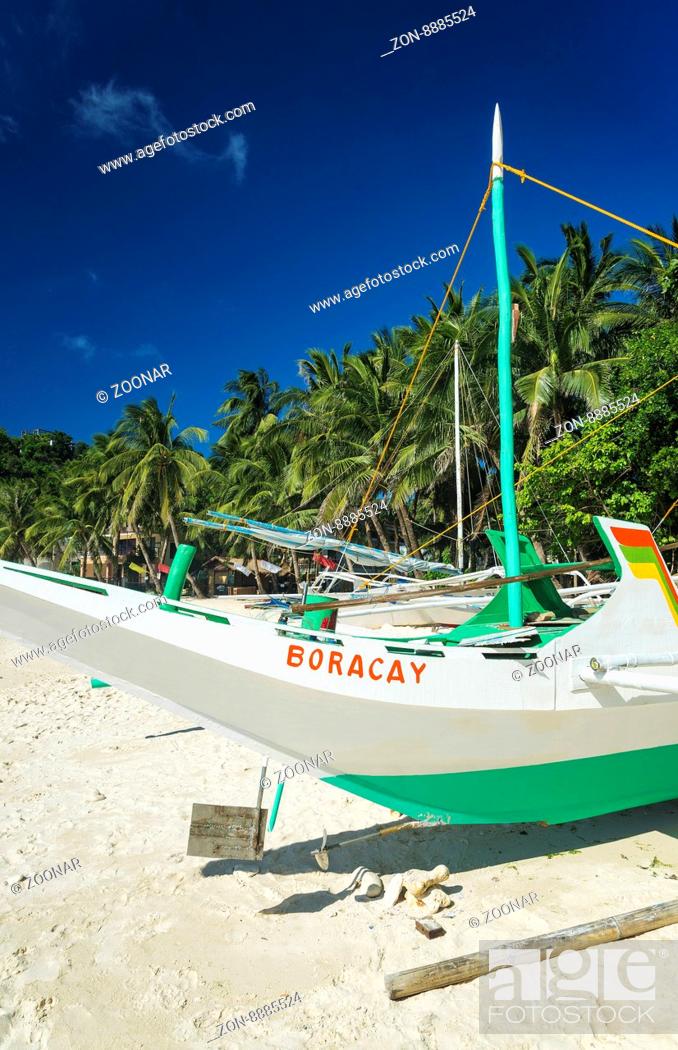 fishing boat on puka beach in tropical paradise boracay