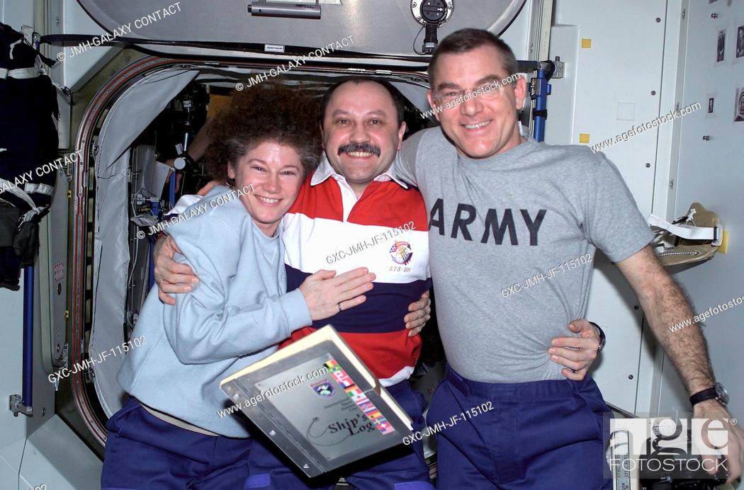 Stock Photo: The Expedition Two crewmembers, Susan J. Helms (left), flight engineer, cosmonaut Yury V. Usachev, mission commander, and James S.