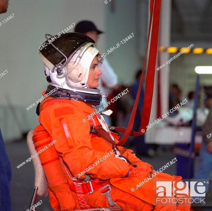 Stock Photo: Astronaut Julie Payette stands by to simulate a parachute drop into water during emergency bailout training. The STS-96 mission specialist.