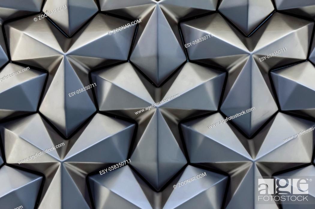 Stock Photo: Abstract silver metal background. Geometric metal pattern angular cladding. Modern wallpaper backdrop.