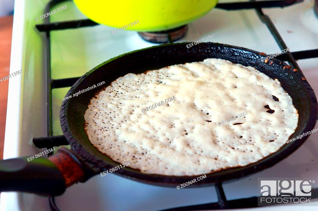 Stock Photo: pancakes on Shrove Tuesday, pancake maker pan.