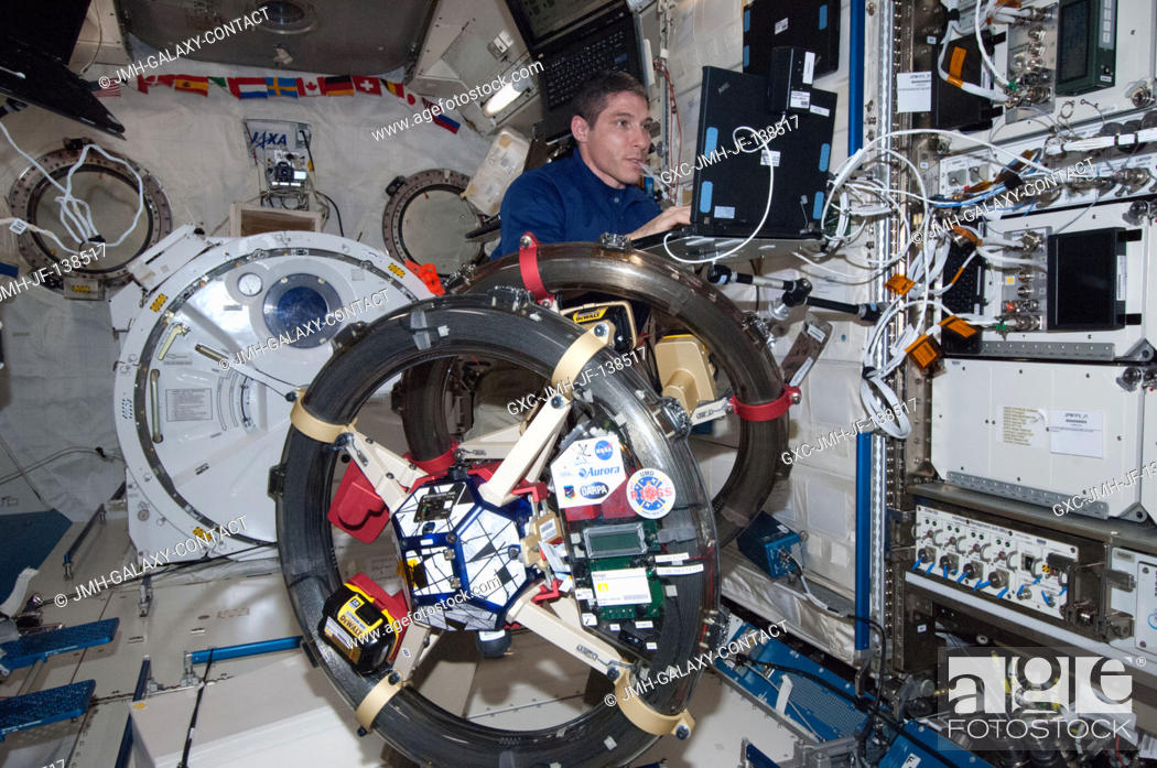 Stock Photo: NASA astronaut Mike Hopkins, Expedition 38 flight engineer, works with the Synchronized Position, Hold, Engage, Reorient.