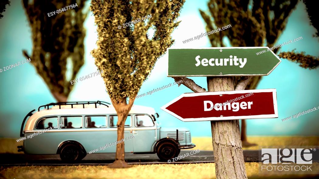 Stock Photo: Street Sign the Direction Way to Security versus Danger.