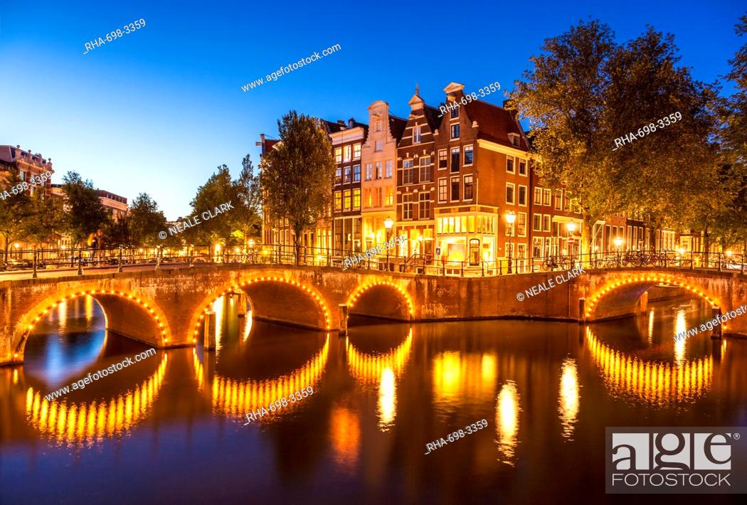 Stock Photo: Illuminated bridges and reflections at night, Keizergracht and Leilesgracht canals, Amsterdam, North Holland, Netherlands, Europe.