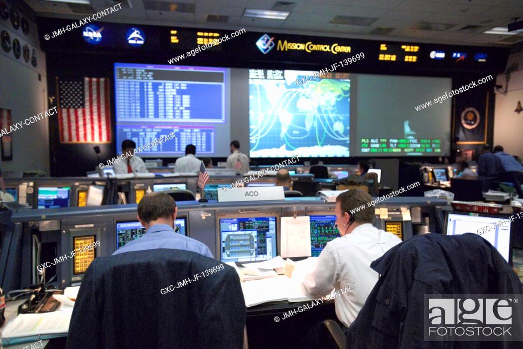 Stock Photo: An overall view of activity in the Shuttle (White) Flight Control Room as flight controllers participate in a long-duration simulation for the STS-114 mission.