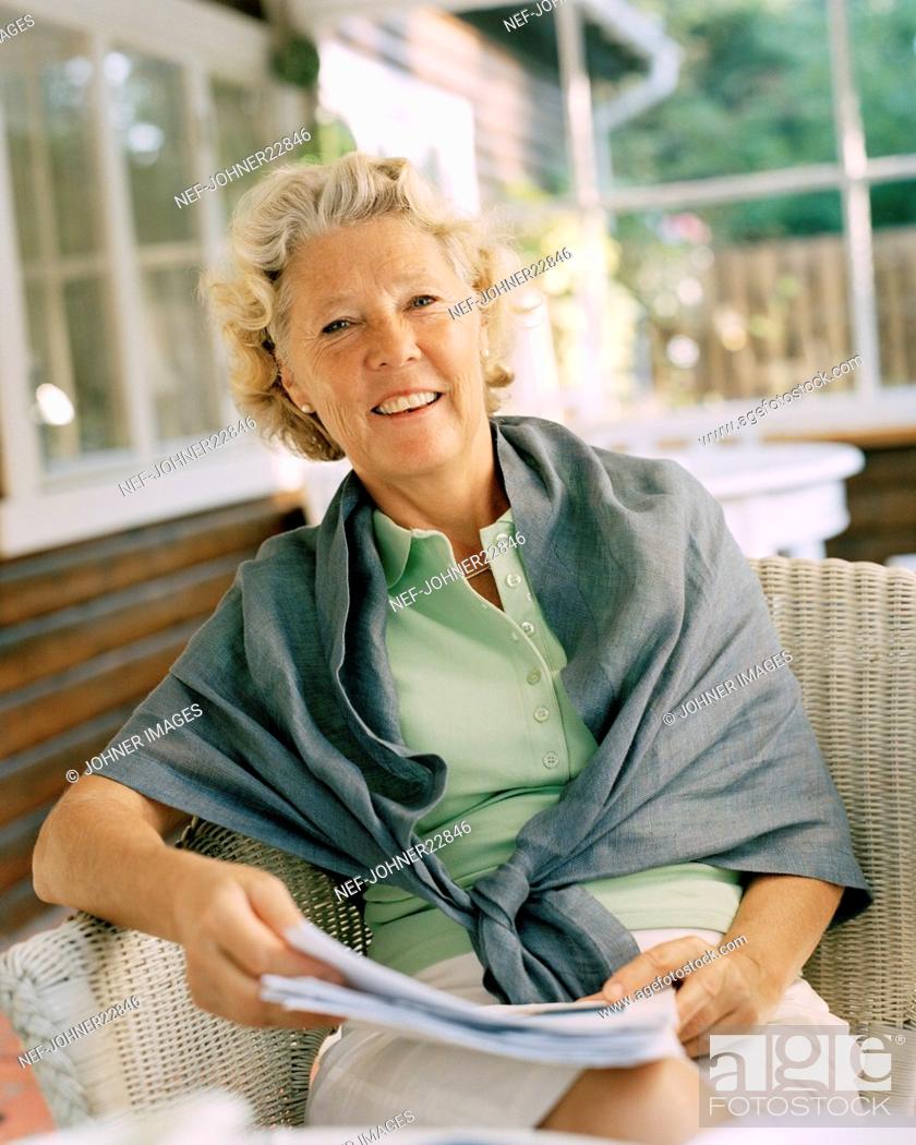 Stock Photo: Looking At Camera, Color Image, Only, One, Outdoors, People, Portrait, Vertical, Woman, Happy, Positive, Smile, Relaxation, Sitting, Friendly, Old, Elderly, Year, Porch, Optimism, Shawl, Senior Adult, Front View, One Person, One Woman Only, Woman (Only), 75-79, 70-74, Adults Only