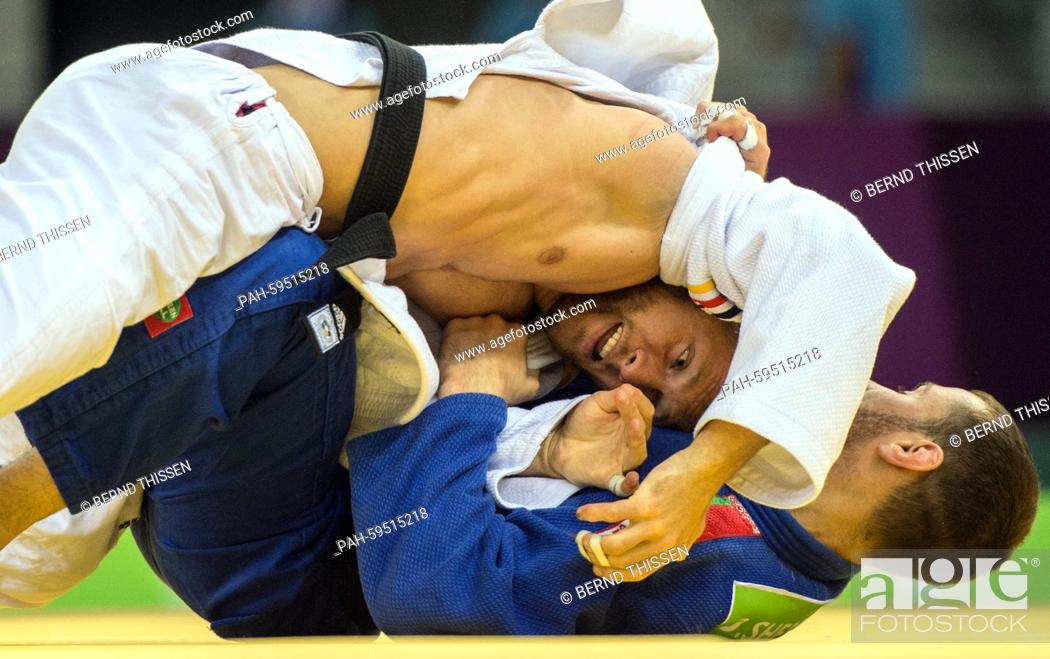 Stock Photo: Germanys Sebastian Seidel (white) competes with Dzmitry Shershan of Bulgaria in the Men's -66kg Judo Repechage at the Baku 2015 European Games in Heydar Aliyev.