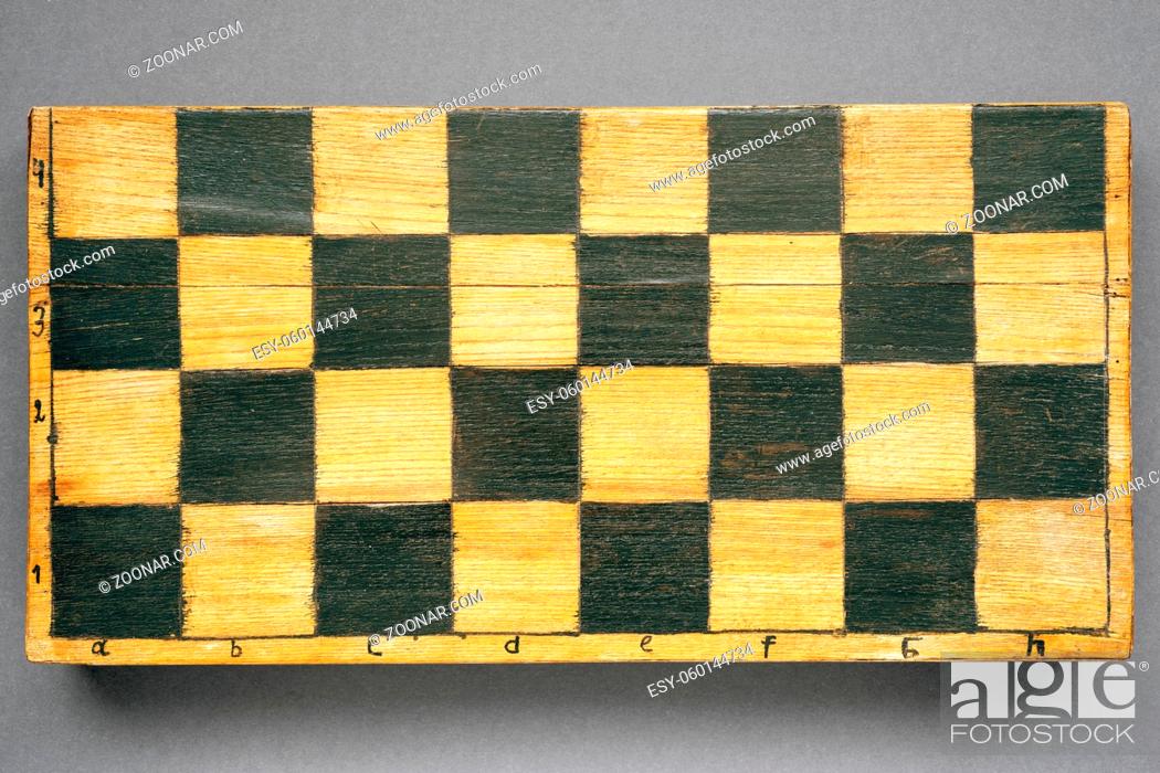 Stock Photo: vintage handmade chess box with square pattern on front surface.