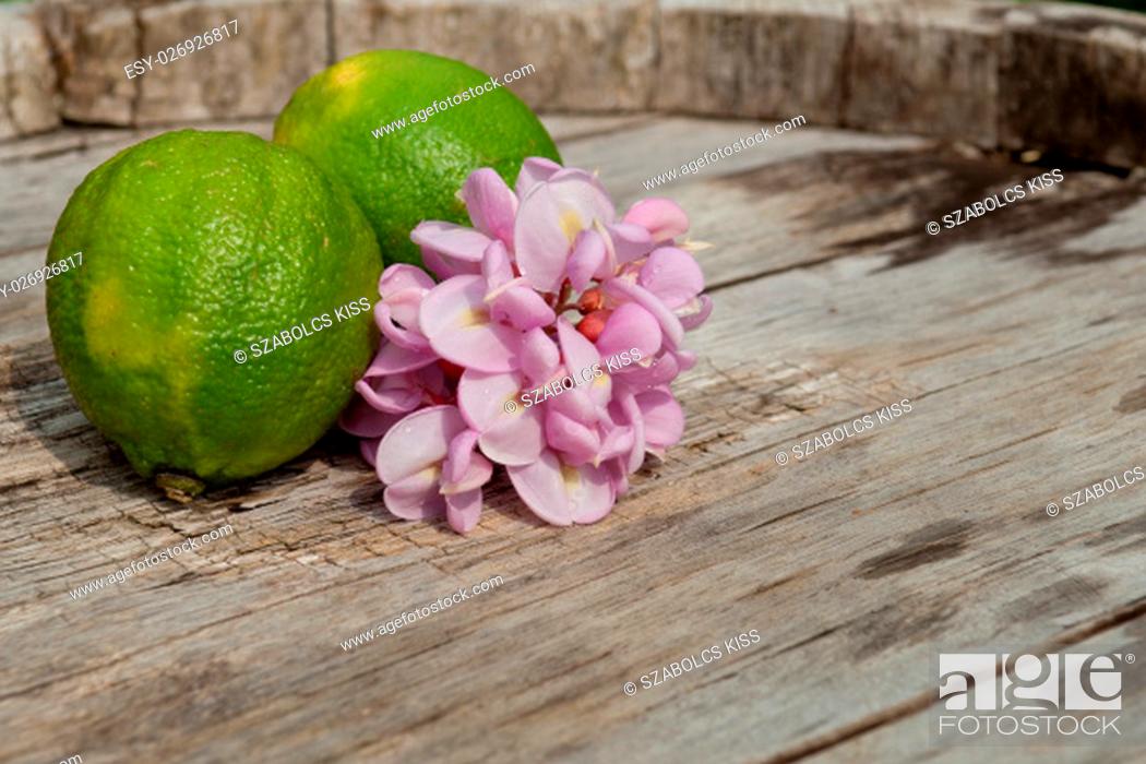 Stock Photo: Raw textured wood Background backdrop with lemon and lime and copy space outdoor.