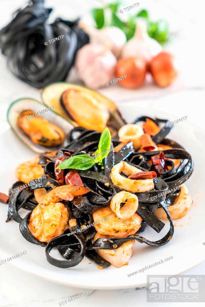 Stock Photo: black spaghetti or pasta with seafood on plate.