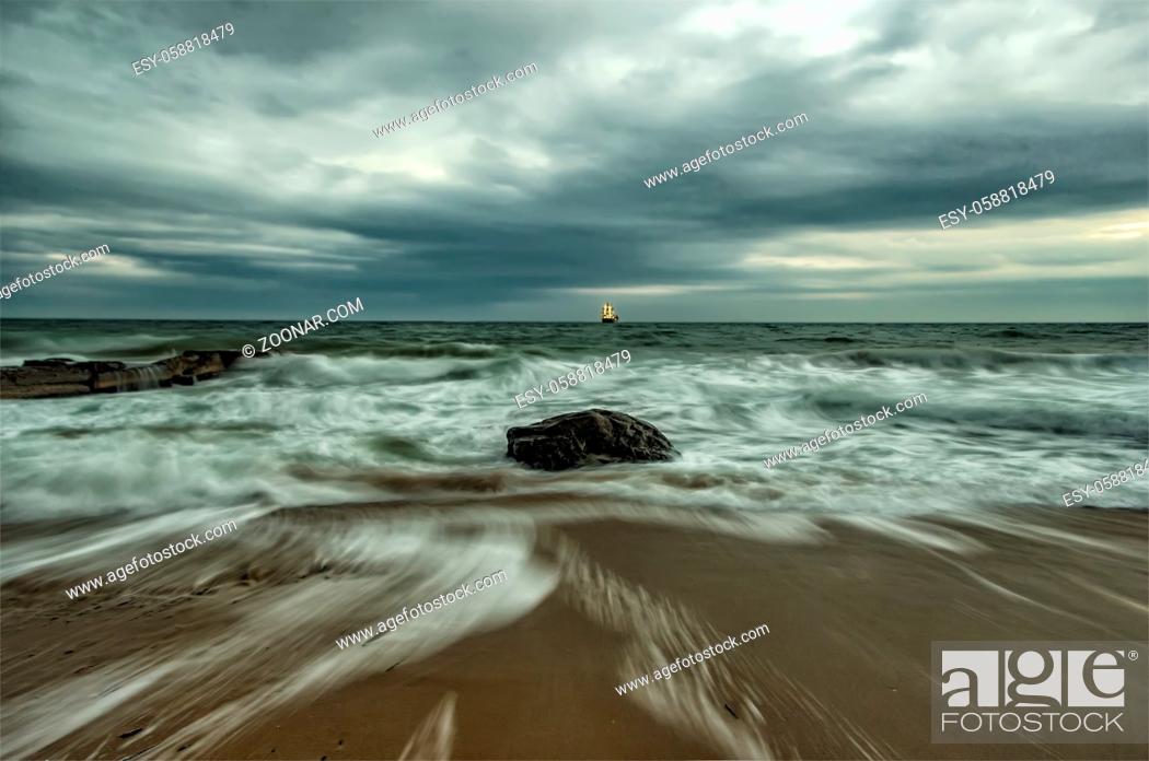 Stock Photo: Beauty cloudy, long exposure seascape with slow shutter and waves flowing out.