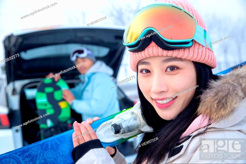 Stock Photo: The young couple after the car carrying skis.