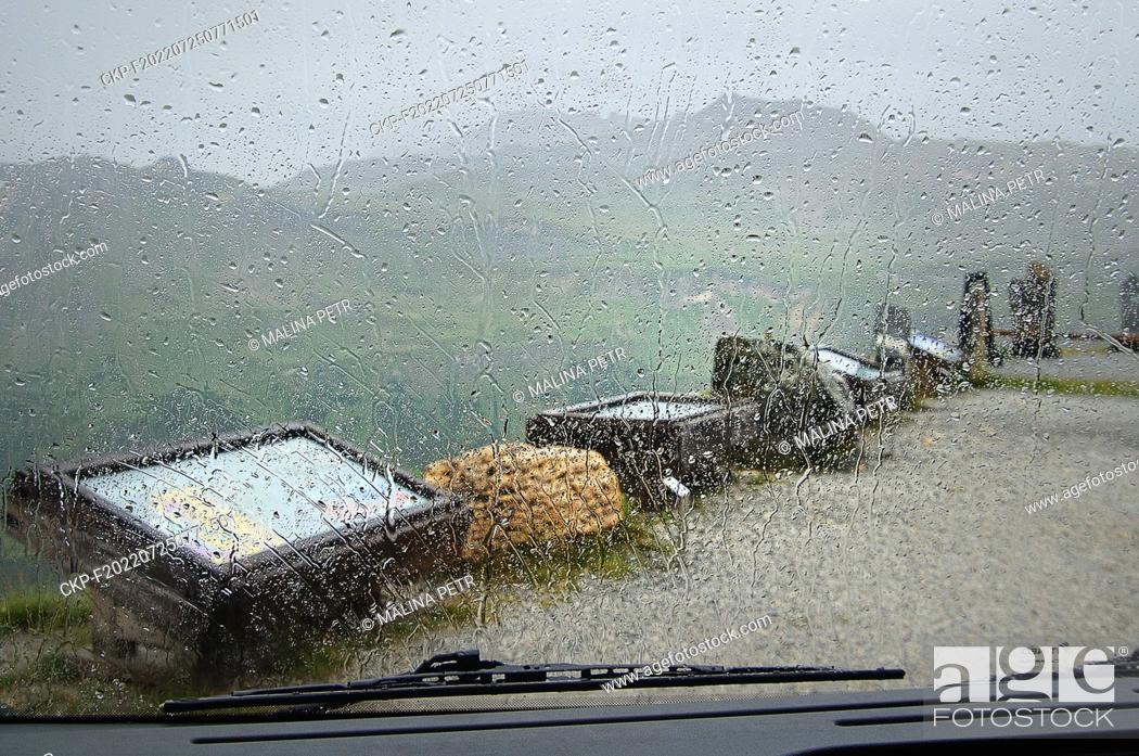 Stock Photo: The top of the GroSglocknerstraSe high mountain road and a view through a wet car window at tourist information signs. (CTK Photo/Petr Malina).