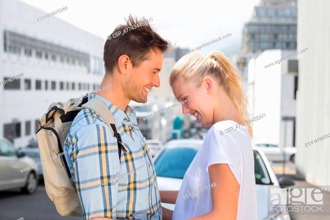 Stock Photo: Hip young couple smiling at each other.