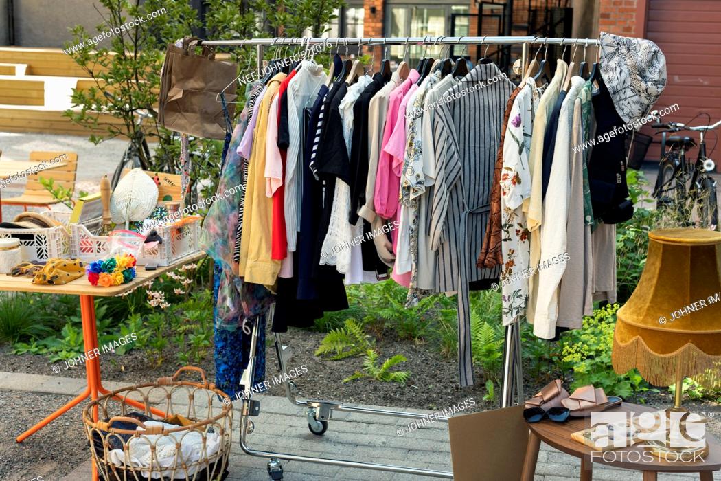 Photo de stock: Clothes in rack at yard sale.