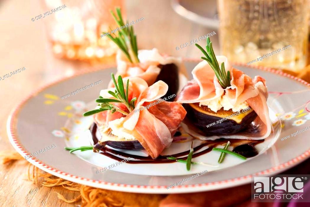 Stock Photo: Figs with Prosciutto, Goat Cheese and Rosemary.