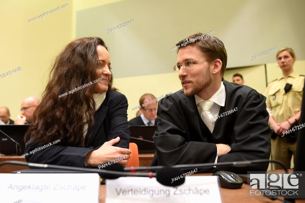 Stock Photo: Defendant Beate Zschaepe (front L-R) talks to her attorney Mathias Grasel in a courtroom as her trial continues at the regional court in Munich, Germany.