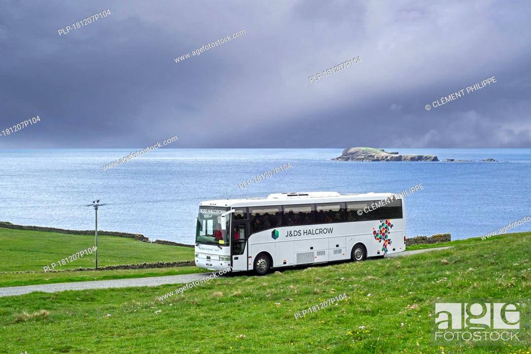Stock Photo: J&D S Halcrow bus driving tourists to Sumburgh Head at the southern tip of Mainland of Shetland, Scotland, UK.