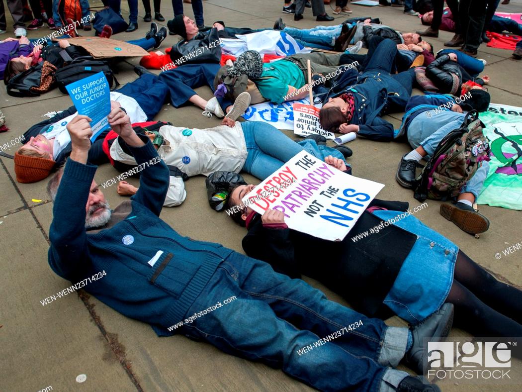 Stock Photo: Student nurses, junior doctors and their supporters hold a die-in protest outside the Department of Health on London's Whitehall during the first day of the 48.
