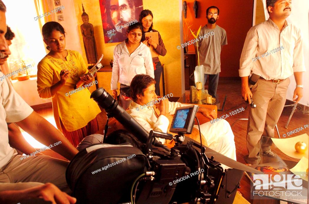Photo de stock: South Asian Indian Bollywood film star Amitabh Bachchan shooting for ad film in Mehboob studio ; Bombay Mumbai ; Maharashtra ; India.