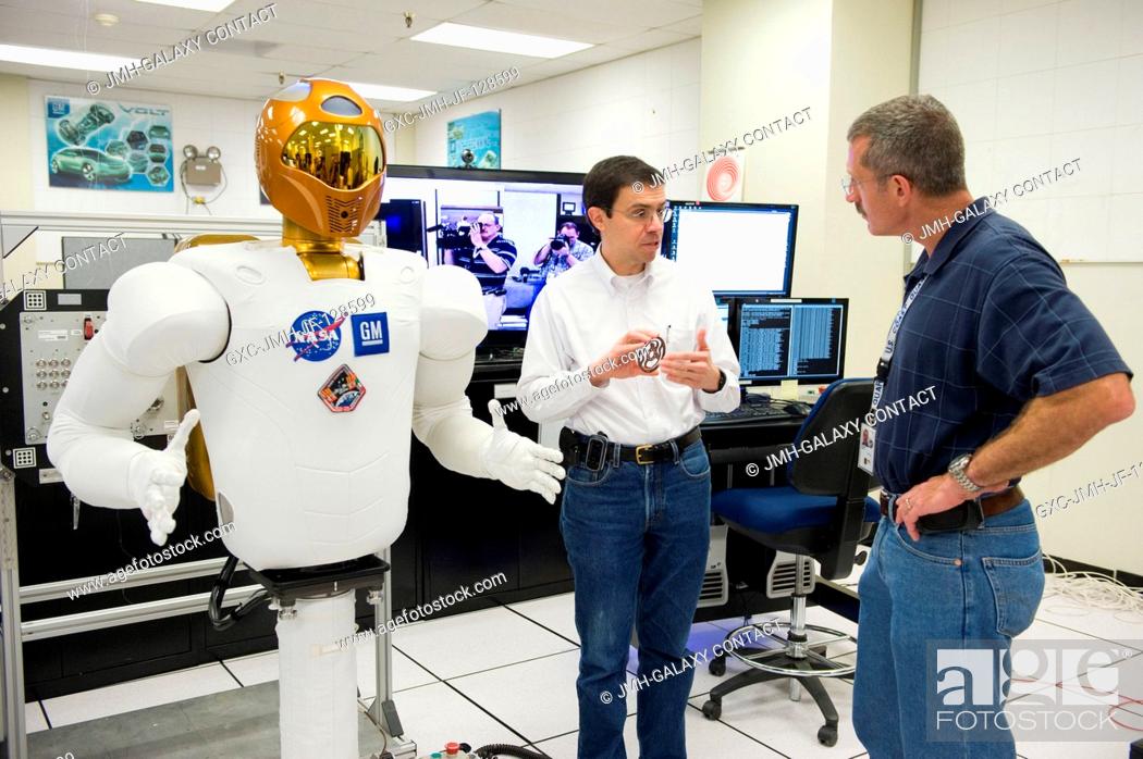 Stock Photo: NASA astronaut Dan Burbank (right), Expedition 29 flight engineer and Expedition 30 commander, participates in a Robonaut familiarization training session in.