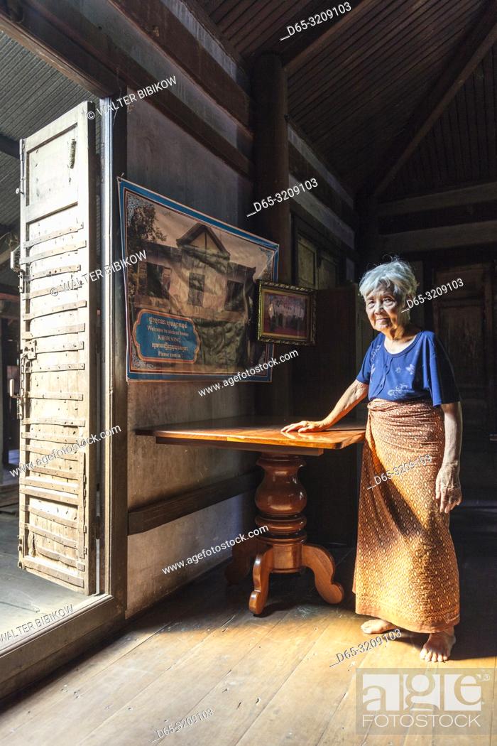 Stock Photo: Cambodia, Battambang, Wat Kor Village, Khor Sang House, older Cambodian woman, owner of traditional Khmer wood house built by her grandfather, NR.
