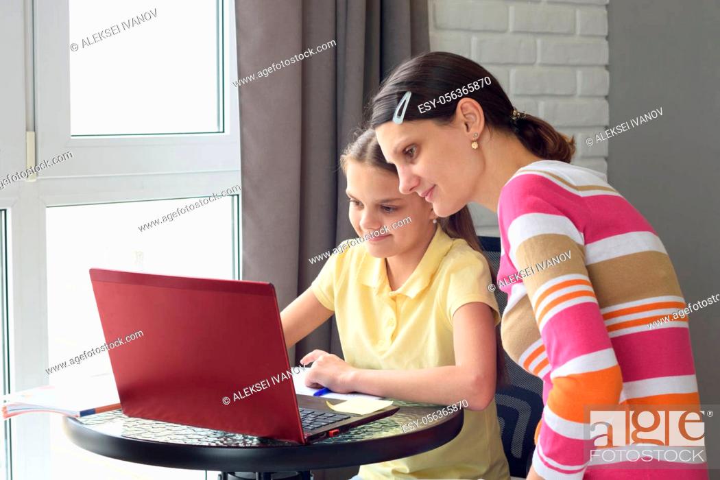 Stock Photo: Mom and child do homework together without leaving home.