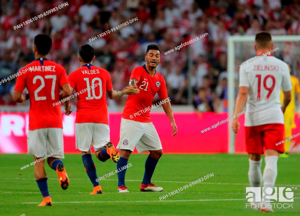 Stock Photo: 8 June 2018, Poznan, Poland: Soccer, Friendly Match Poland vs. Chile at the INEA Stadium Poznan: Martinez (L-R), Valdes and Lorenzo Reyes cheer over their 2-1.