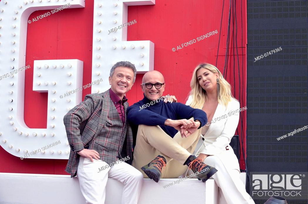 Stock Photo: Italian singer Enzo Ghinazzi named Pupo italian journalist Alfonso Signorini and Argentinian showgirl Wanda Nara attend tv broadcast Grande Fratello Vip.