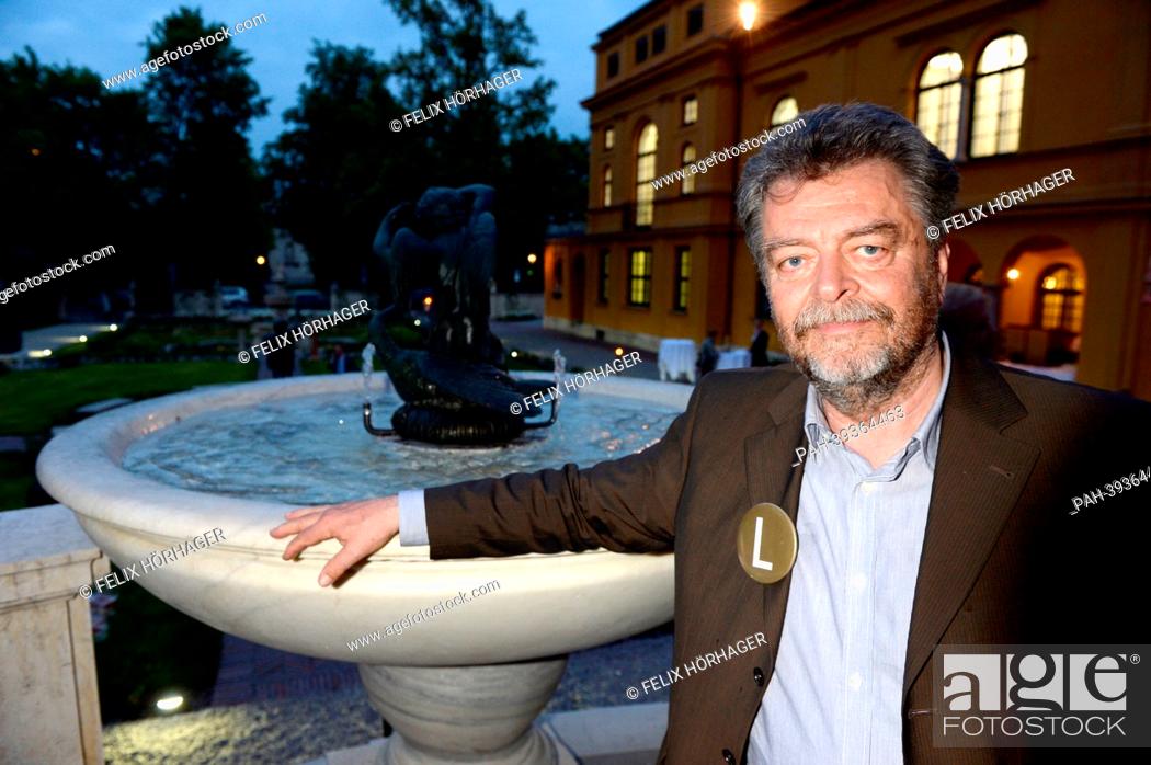 Stock Photo: Museum director Helmut Friedel (L)poses in the garden during the re-opening ceremony of Lenbachhaus in Munich, Germany, 06 May 2013.