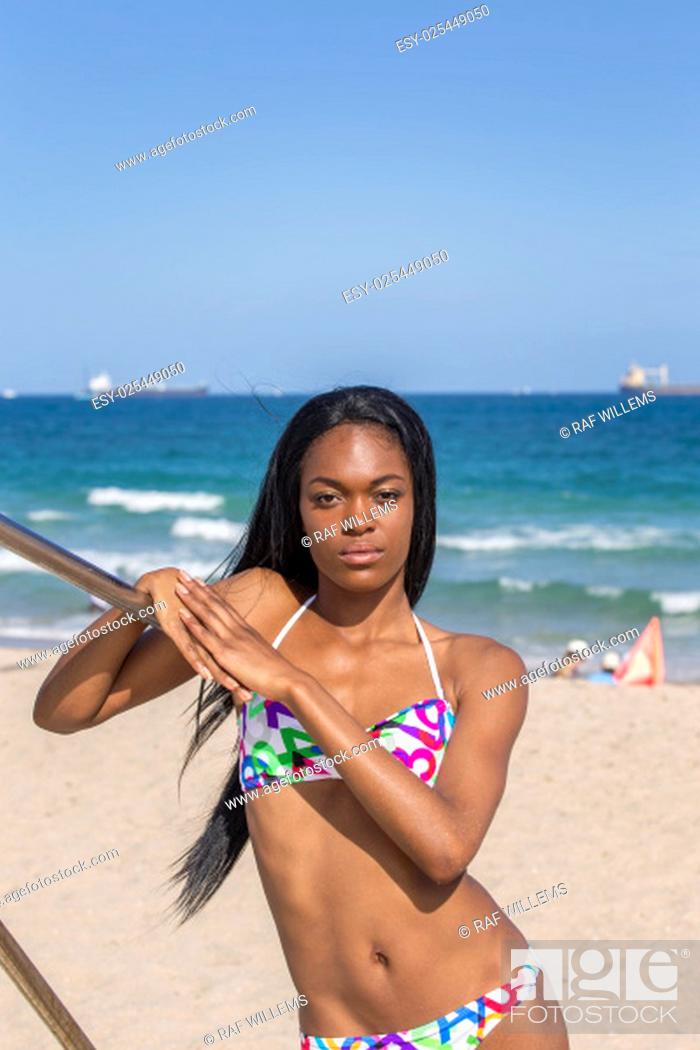 klif helpen Panter Young black woman at the beach, wearing a bikini. Leaning on railing, Stock  Photo, Picture And Low Budget Royalty Free Image. Pic. ESY-025449050 |  agefotostock