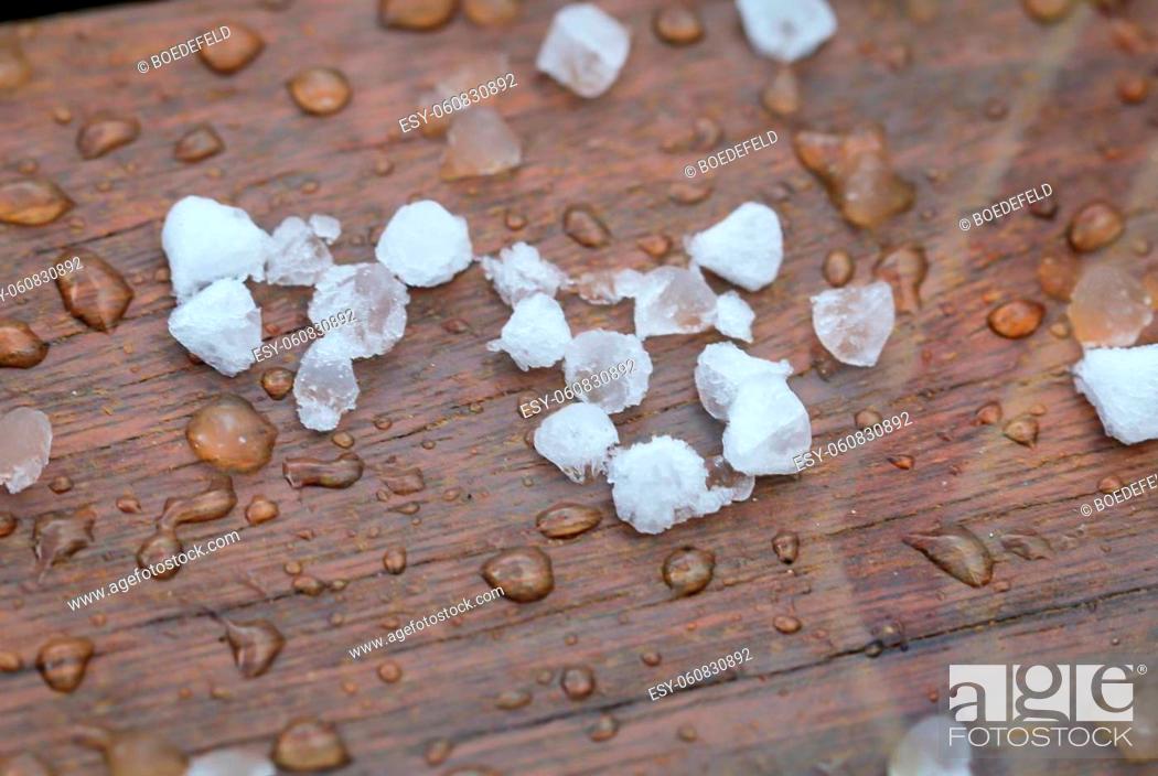 Stock Photo: Lots of hailstones immediately after the impact. Hailstones can cause great damage.