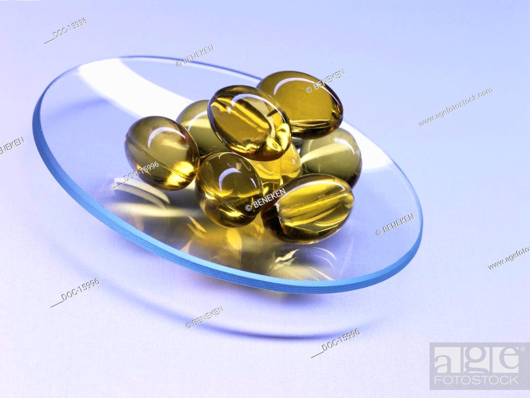 Download Yellow Fish Oil Capsules On A Blue Glassware Bowl Stock Photo Picture And Rights Managed Image Pic Doc 15996 Agefotostock Yellowimages Mockups