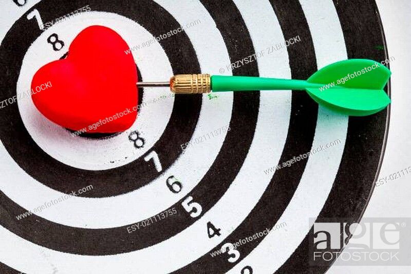Stock Photo: Black white target with dart in heart love symbol as bullseye.