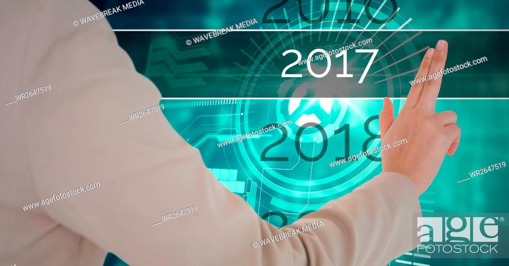Stock Photo: Hand of business woman touching 2017 in 3D digitally generated background.