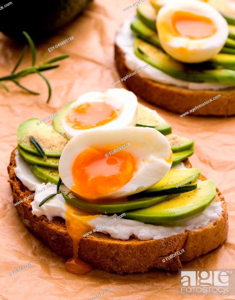 Stock Photo: fresh sliced avocado and boiled egg sandwich.