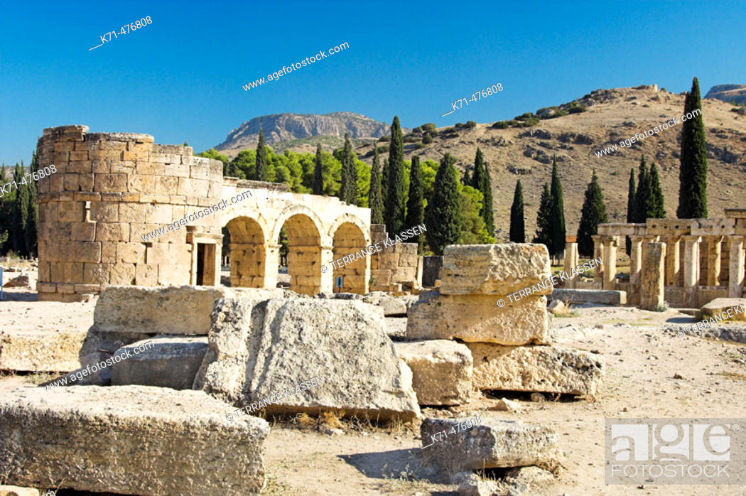 Stock Photo: Frontinus Street and the triple gate of Domintian in the ruins of Hierapolis, Turkey.