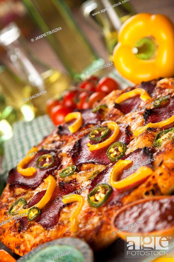 Stock Photo: Delicious pizza served on wooden table.