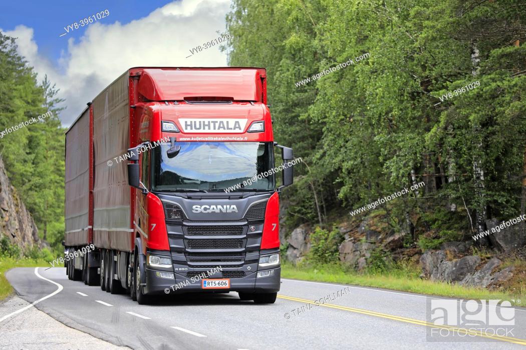 Stock Photo: Red Next Generation Scania R650 truck Huhtala pulls freight trailer on highway on a sunny day of summer. Salo, Finland. July 6, 2019.