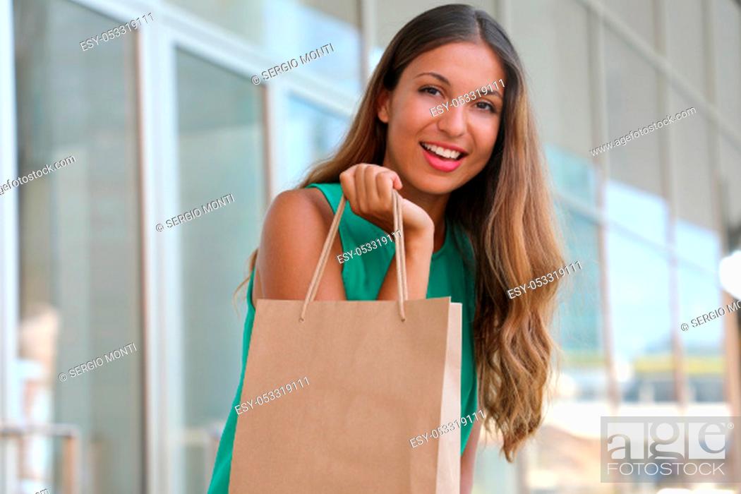 Stock Photo: Portrait of attractive woman with shopper bag in her hand. Beauty fashion smiling girl doing shopping. Let's go shopping concept. Copy space.